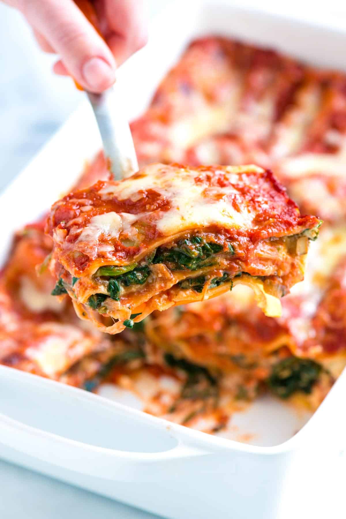 Easy spinach lasagna recipe with fresh spinach, flavorful mushrooms, light tomato sauce, and cheeses. Serving Spinach Mushroom Lasagna