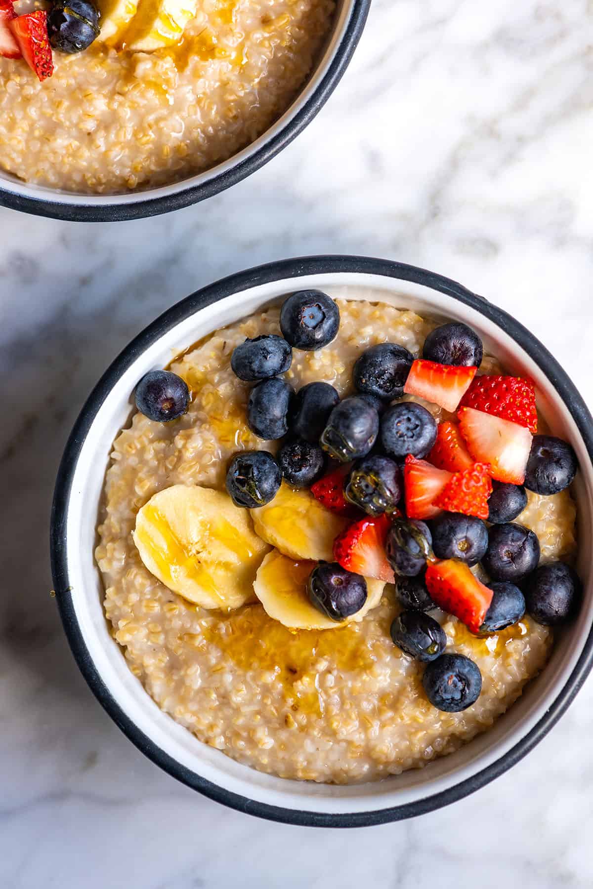 Creamy Steel Cut Oats with berries and banana on top